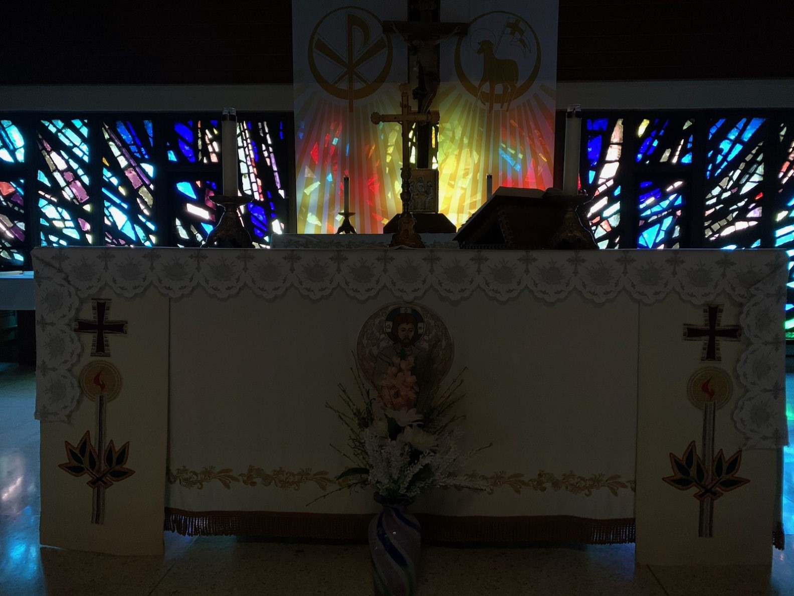 Altar with stained glass lighting in background