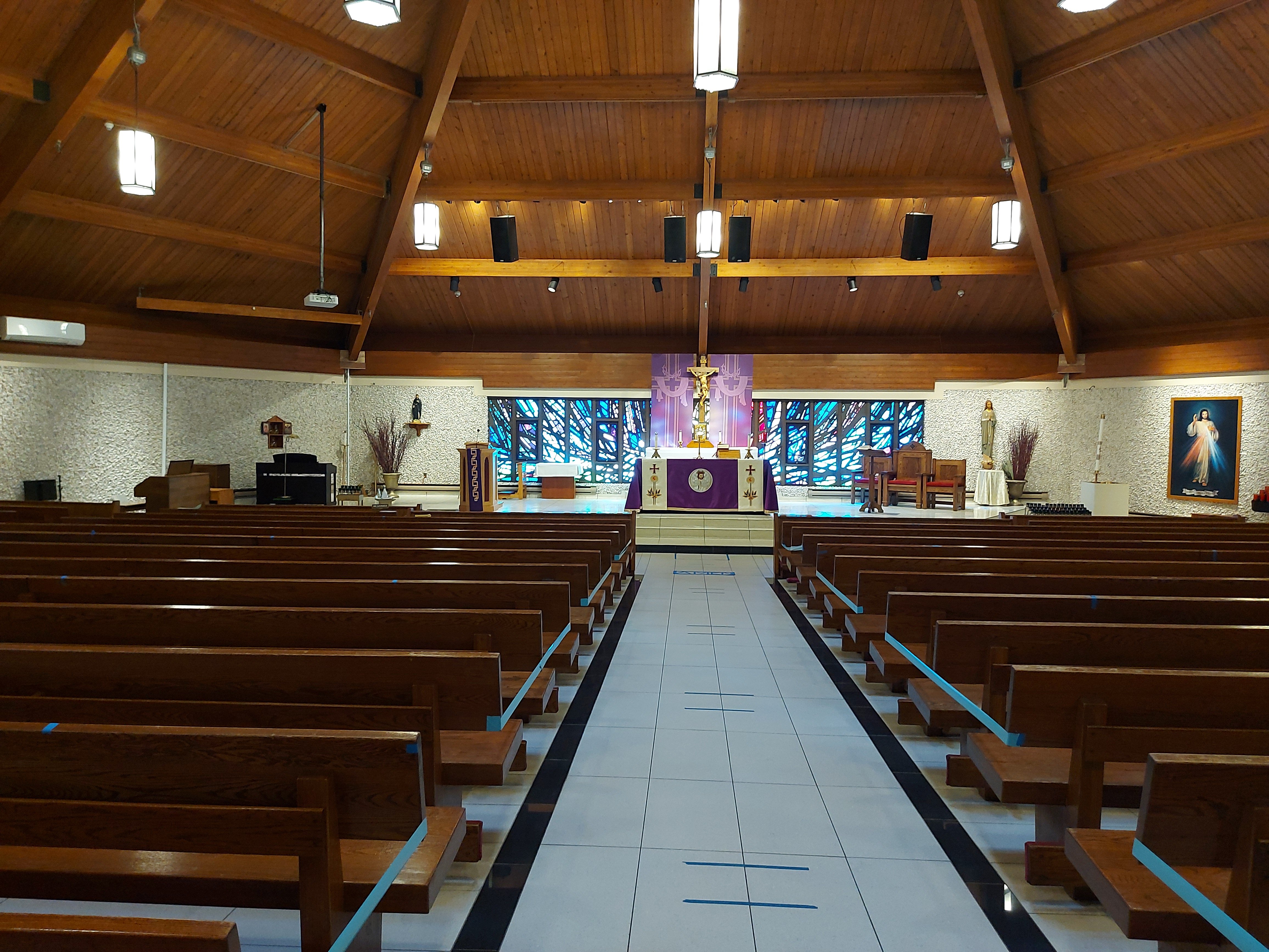 Taken from the back of the Church, a full view of the Sanctuary and the pews of the Church